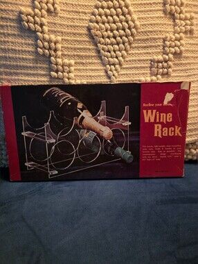 Vintage Regal brand clear acrylic wine rack, designed to hold 6 bottles